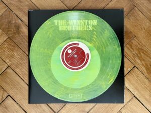 The Winston Brothers - Drift (Colemine Records) - HHV Exclusive Coke Bottle Clear With Yellow Swirl Vinyl Edition